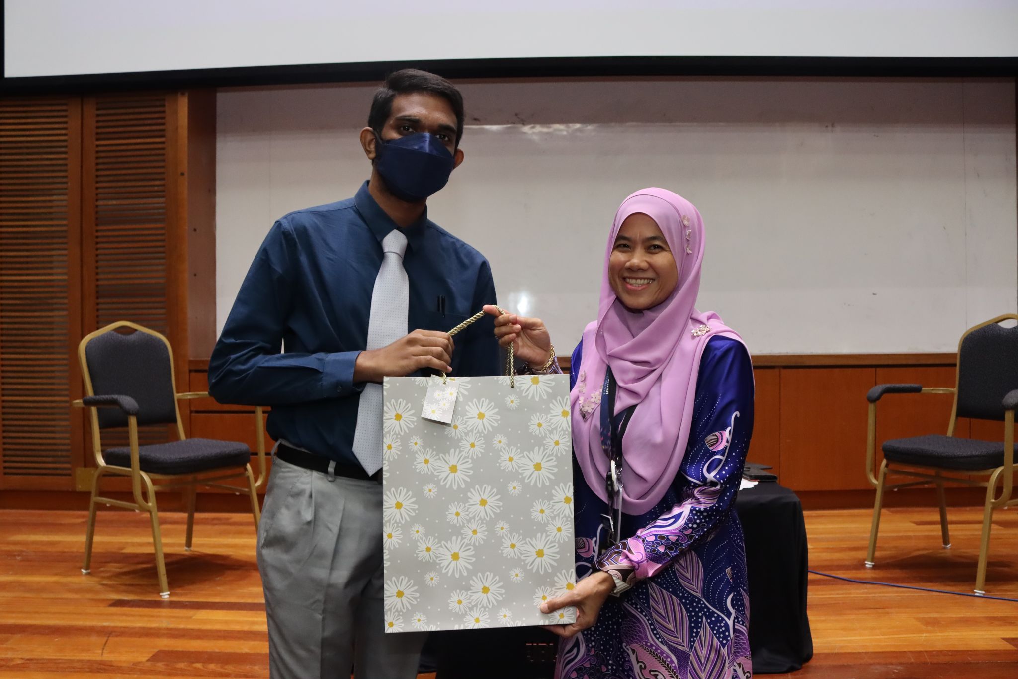 Anitej receiving a token of appreciation.