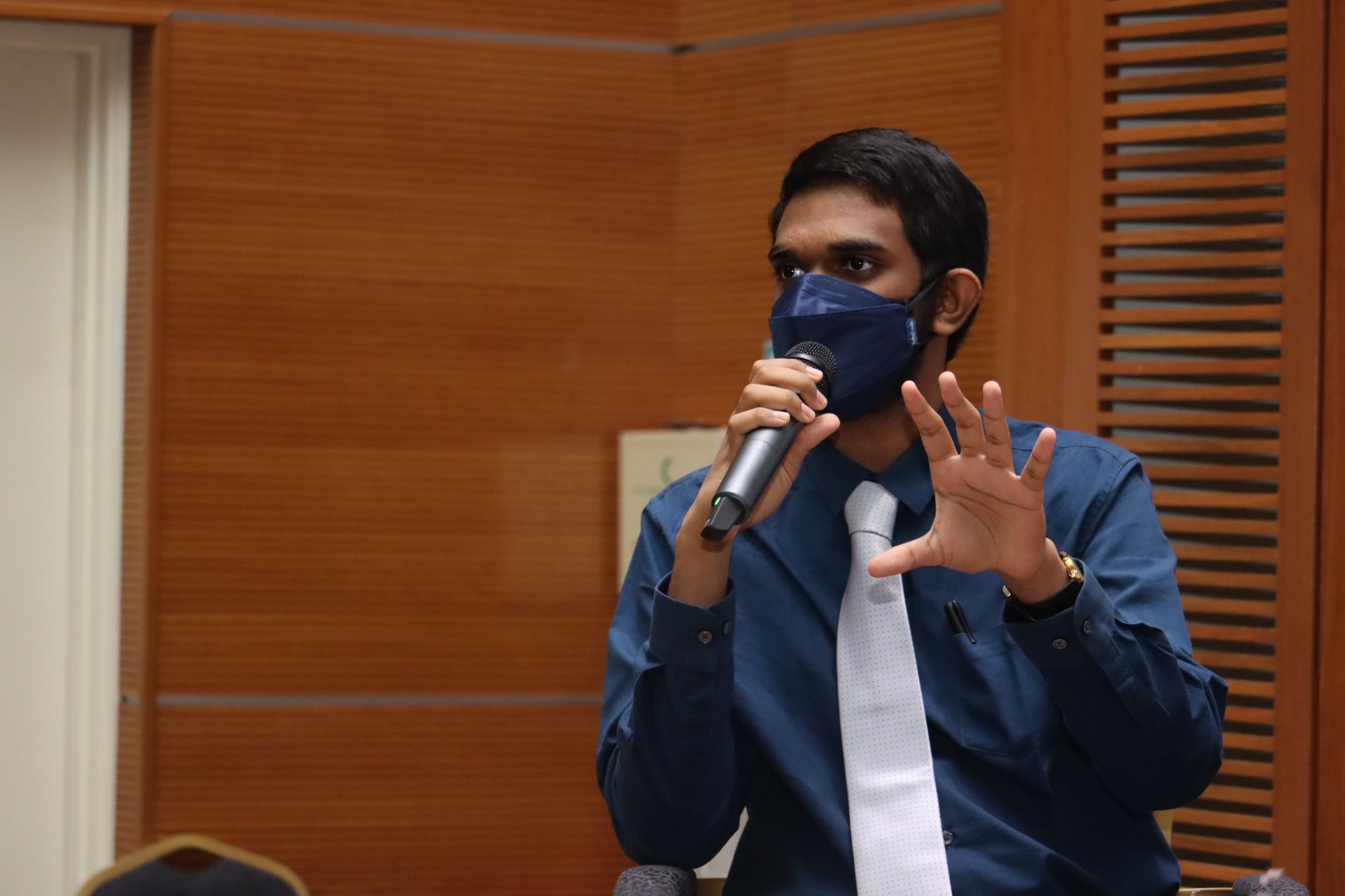 Anitej speaking to the audience.