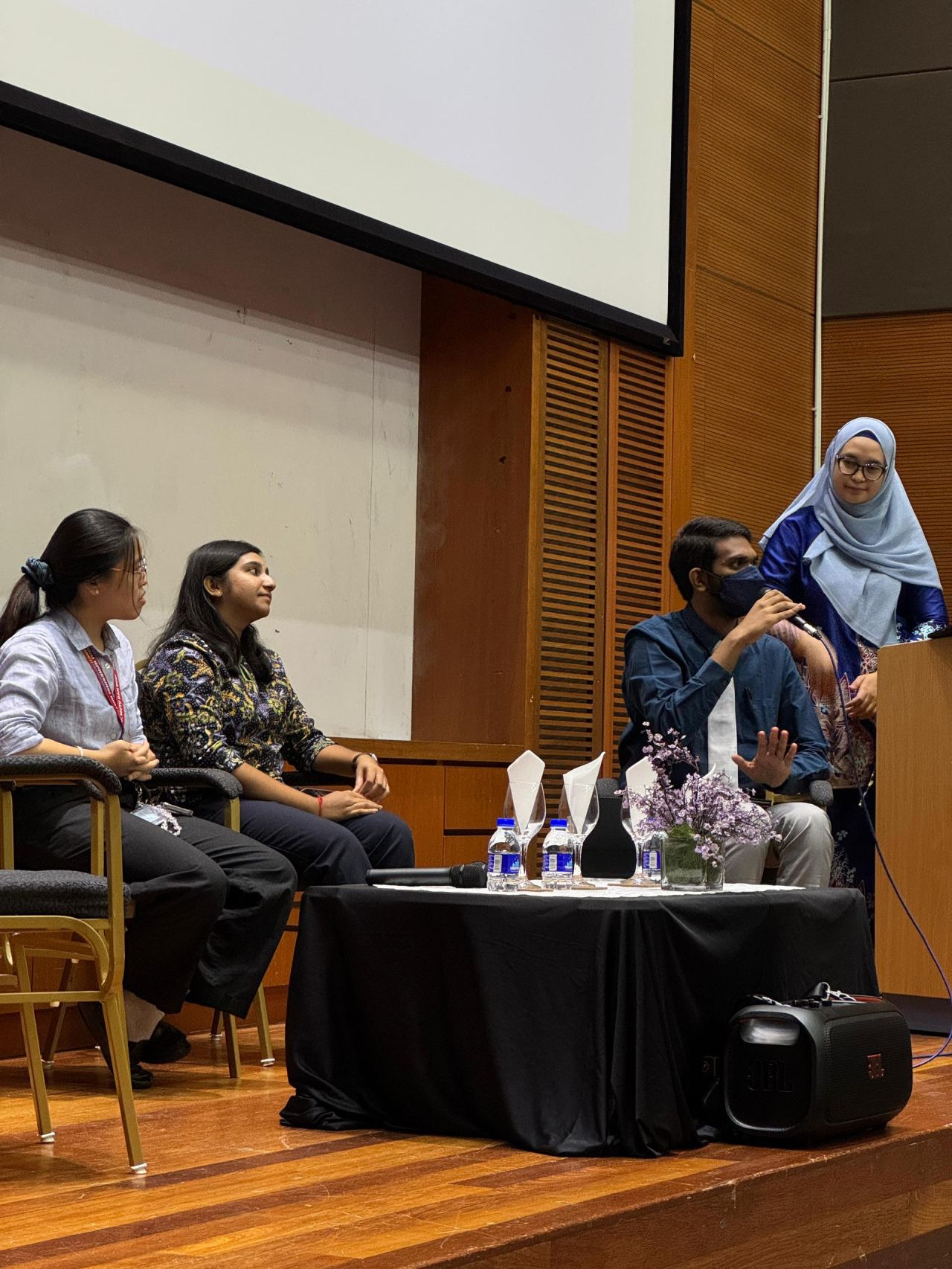 Anitej speaking to the audience.